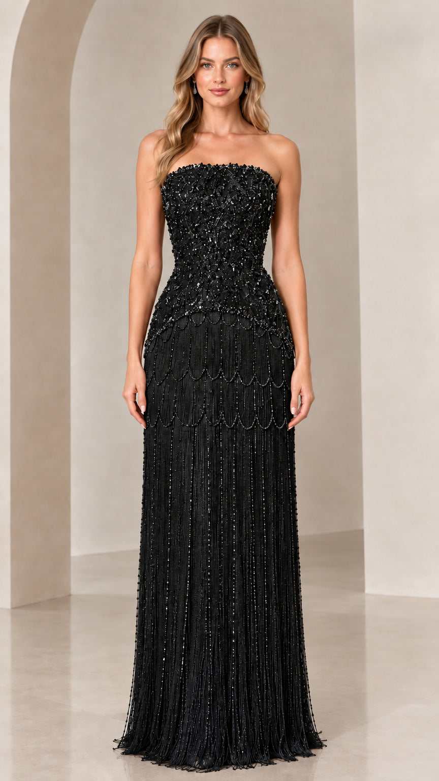 Front view of strapless beaded fringe evening gown in black