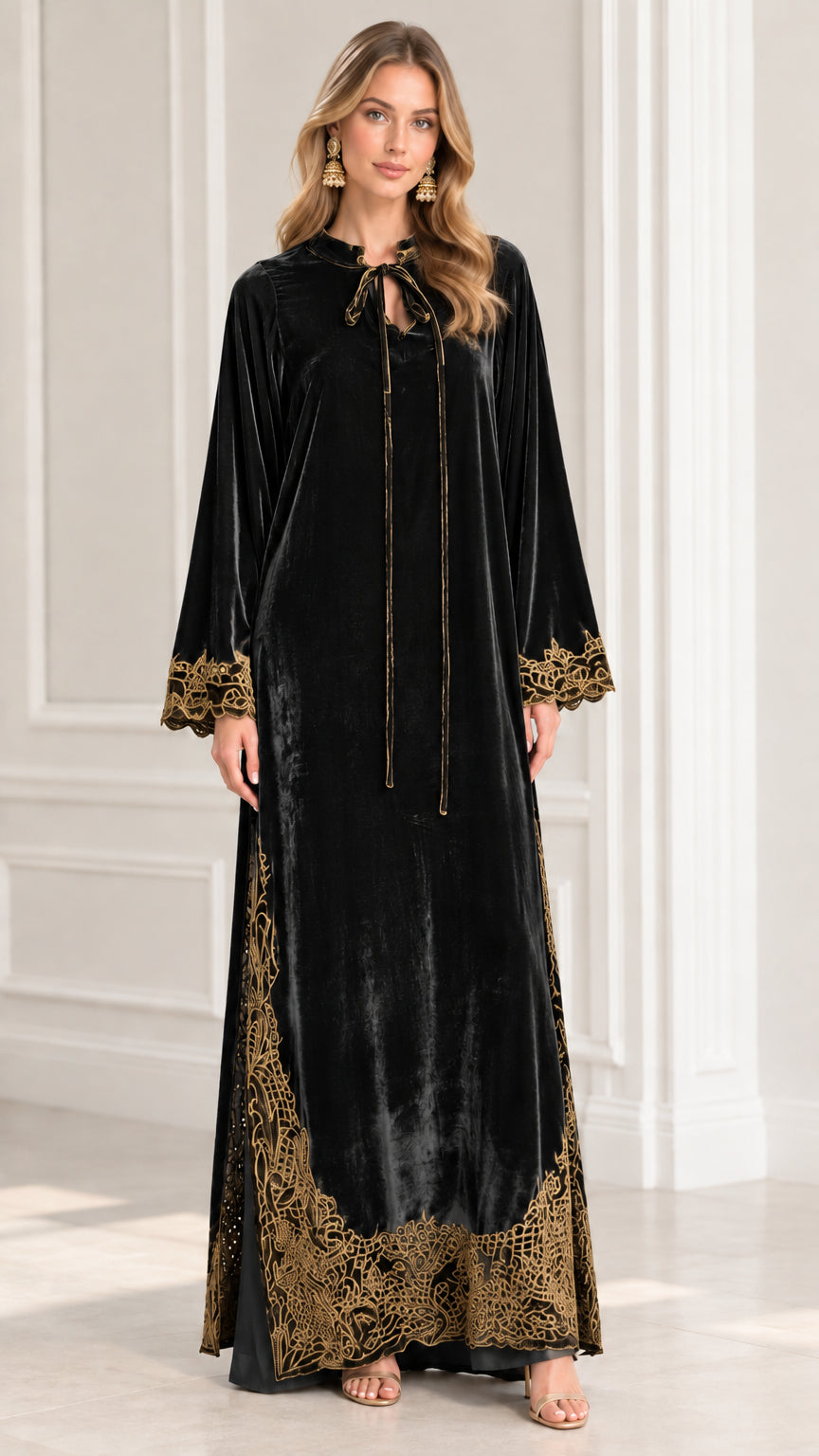 Full front view of model wearing Classic Black embroidered velvet kaftan dress
