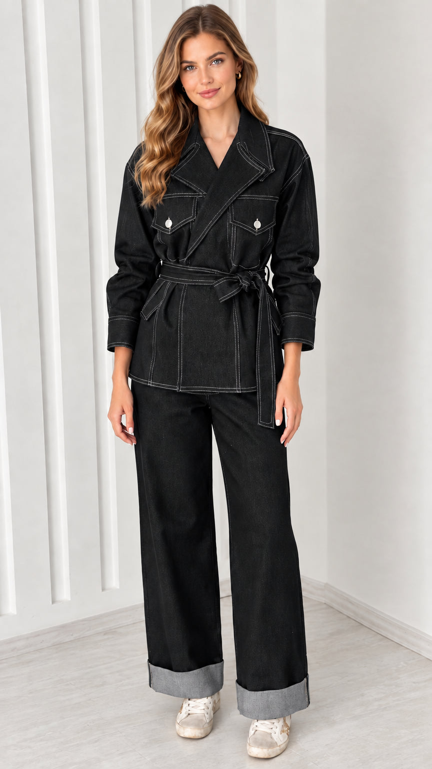 Full-body view of model wearing Black belted utility jacket and cuffed pants set