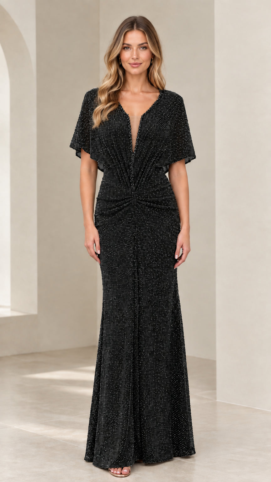 Model wearing Black flutter sleeve plunge neckline shimmer evening gown