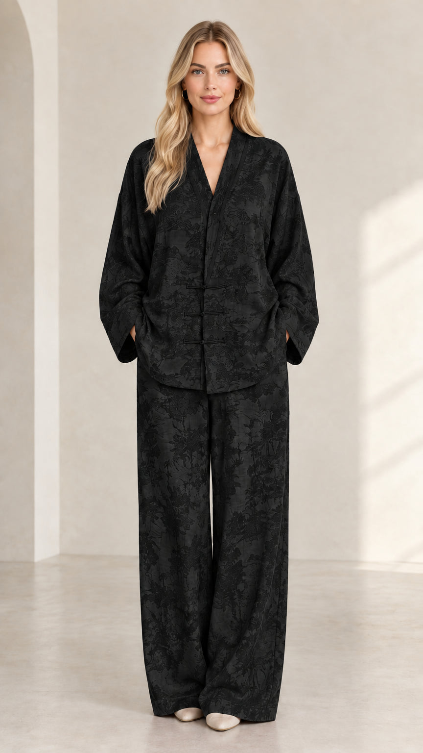 Full front view of women's black jacquard frog button top and wide-leg pant set