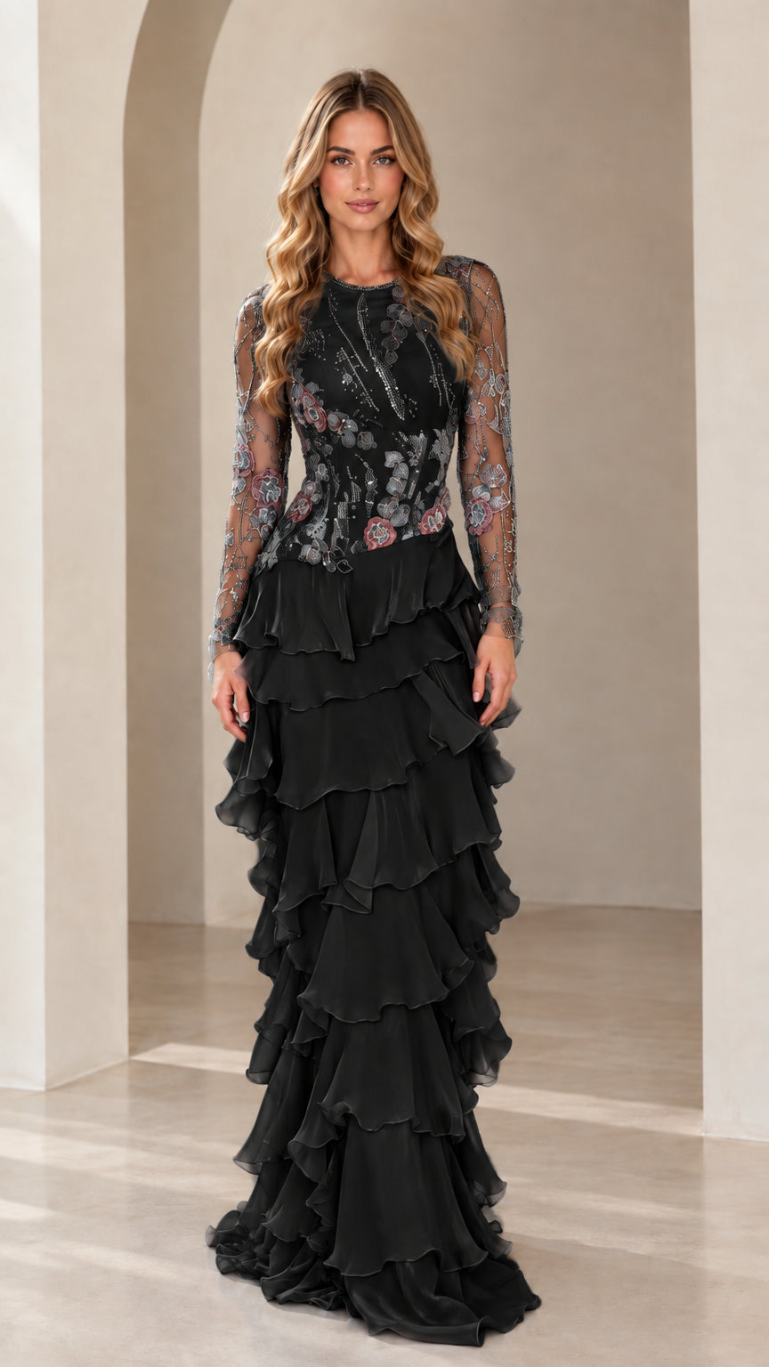 Front view of model wearing Black embroidered long sleeve tiered ruffle evening gown