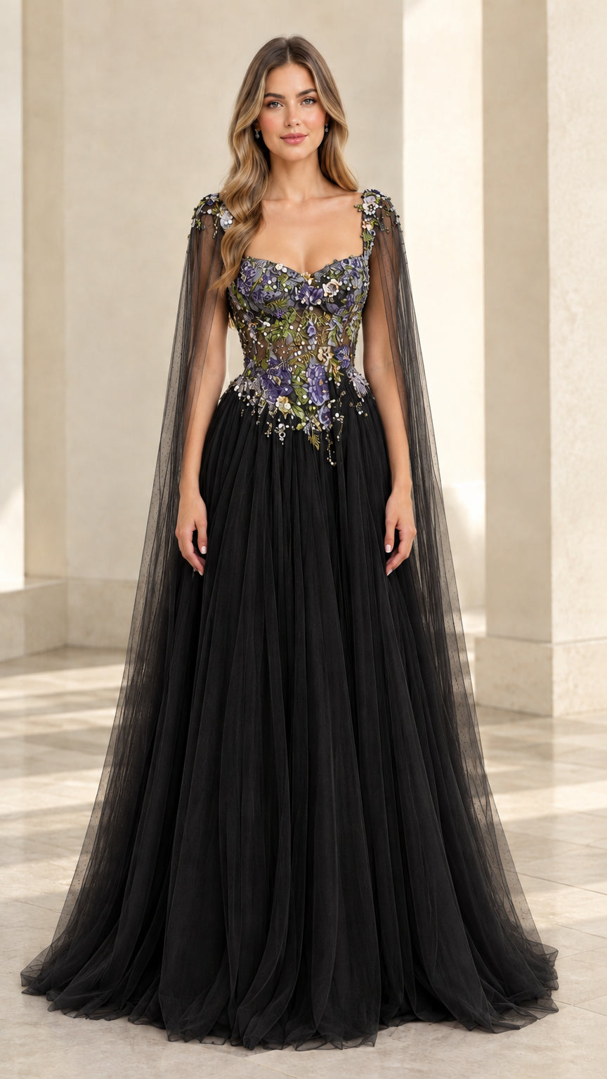 Black sweetheart tulle evening gown with colorful floral embroidery and shoulder capes