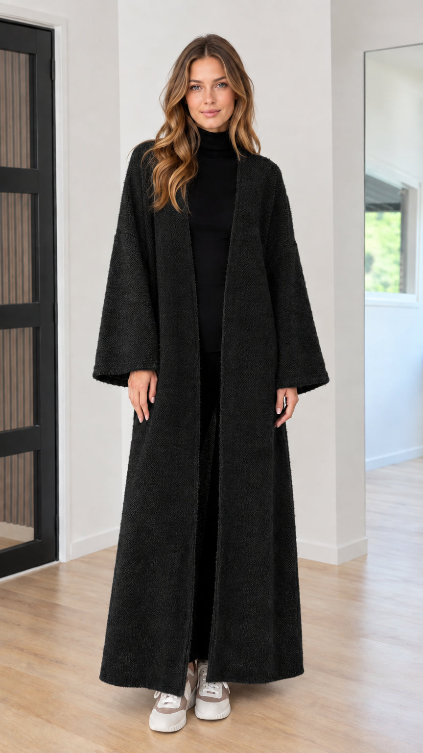 Model wearing black longline open-front knit maxi duster cardigan