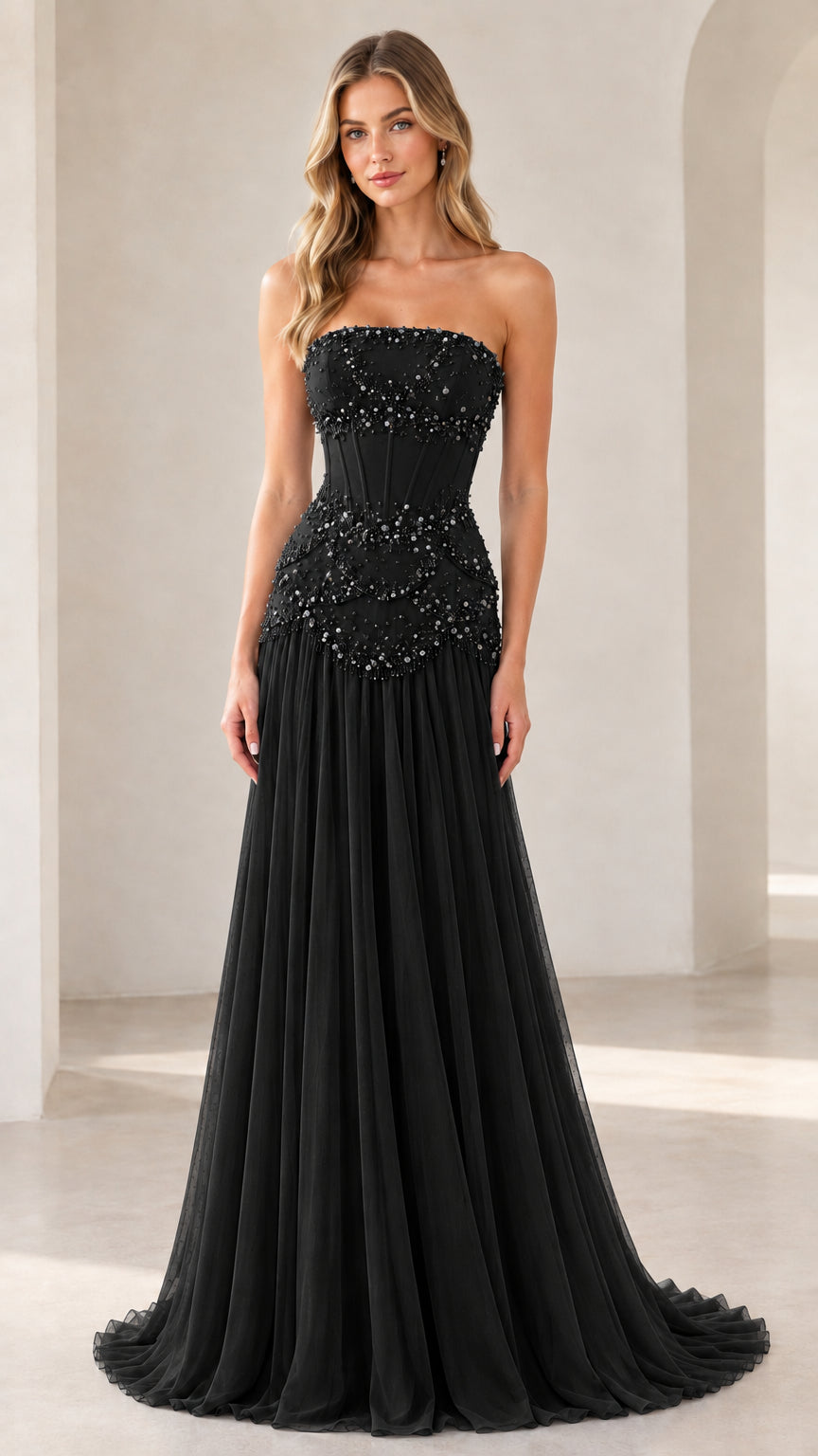 Model wearing black strapless pearl-embellished corset evening gown