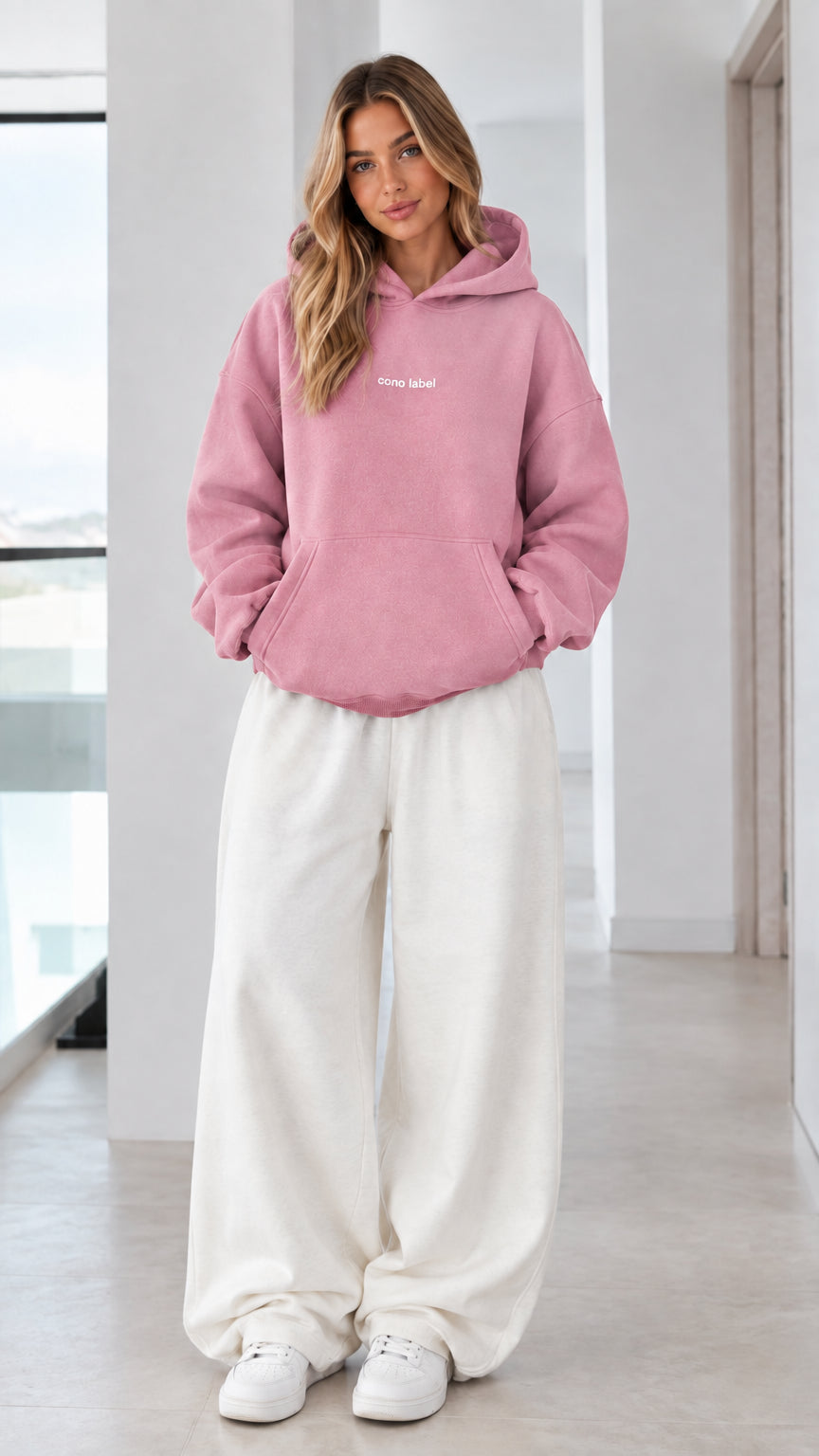Women's dusty pink fleece pullover hoodie on model
