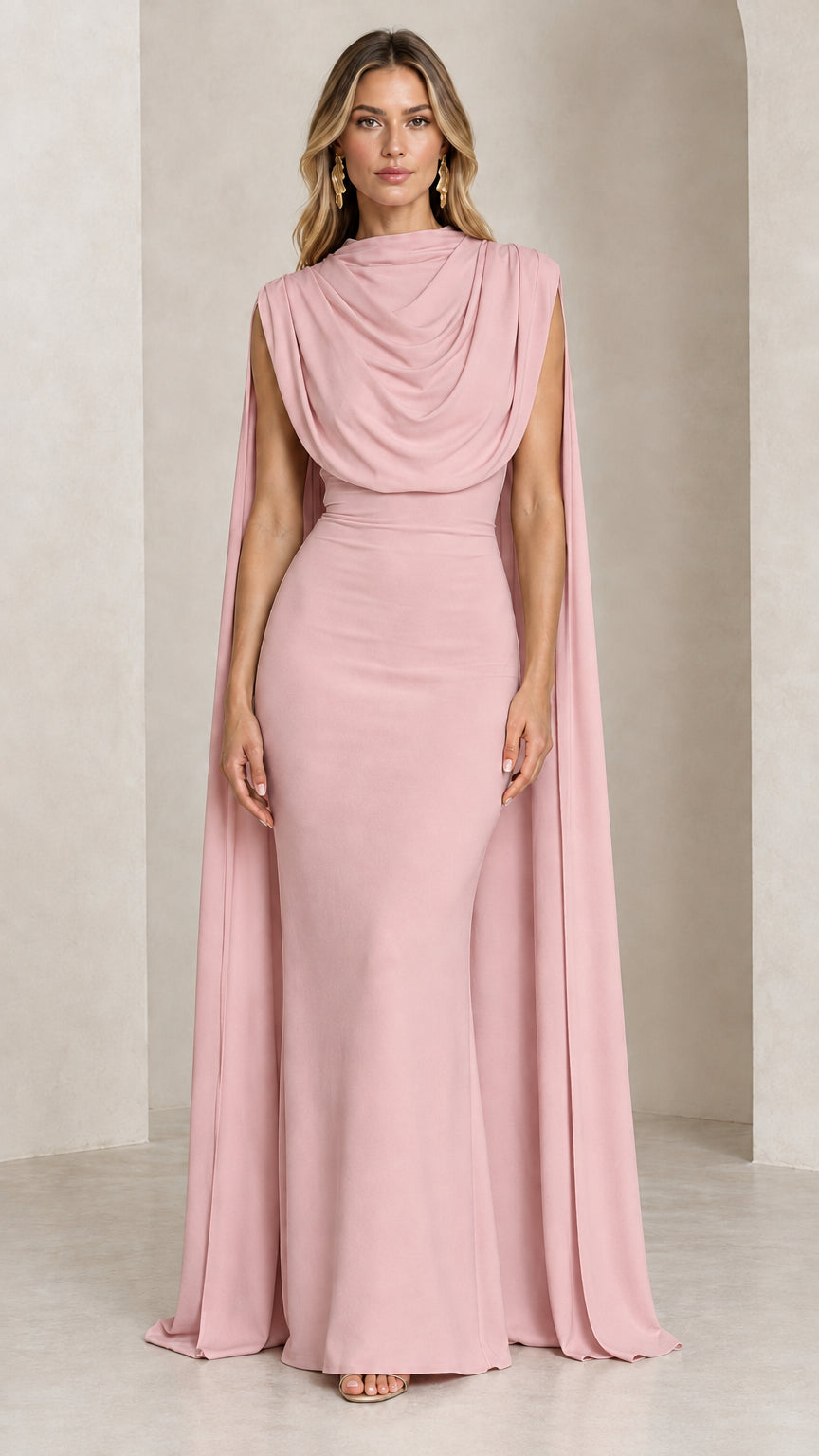 Front view of model wearing the dusty pink draped cowl neck cape evening gown