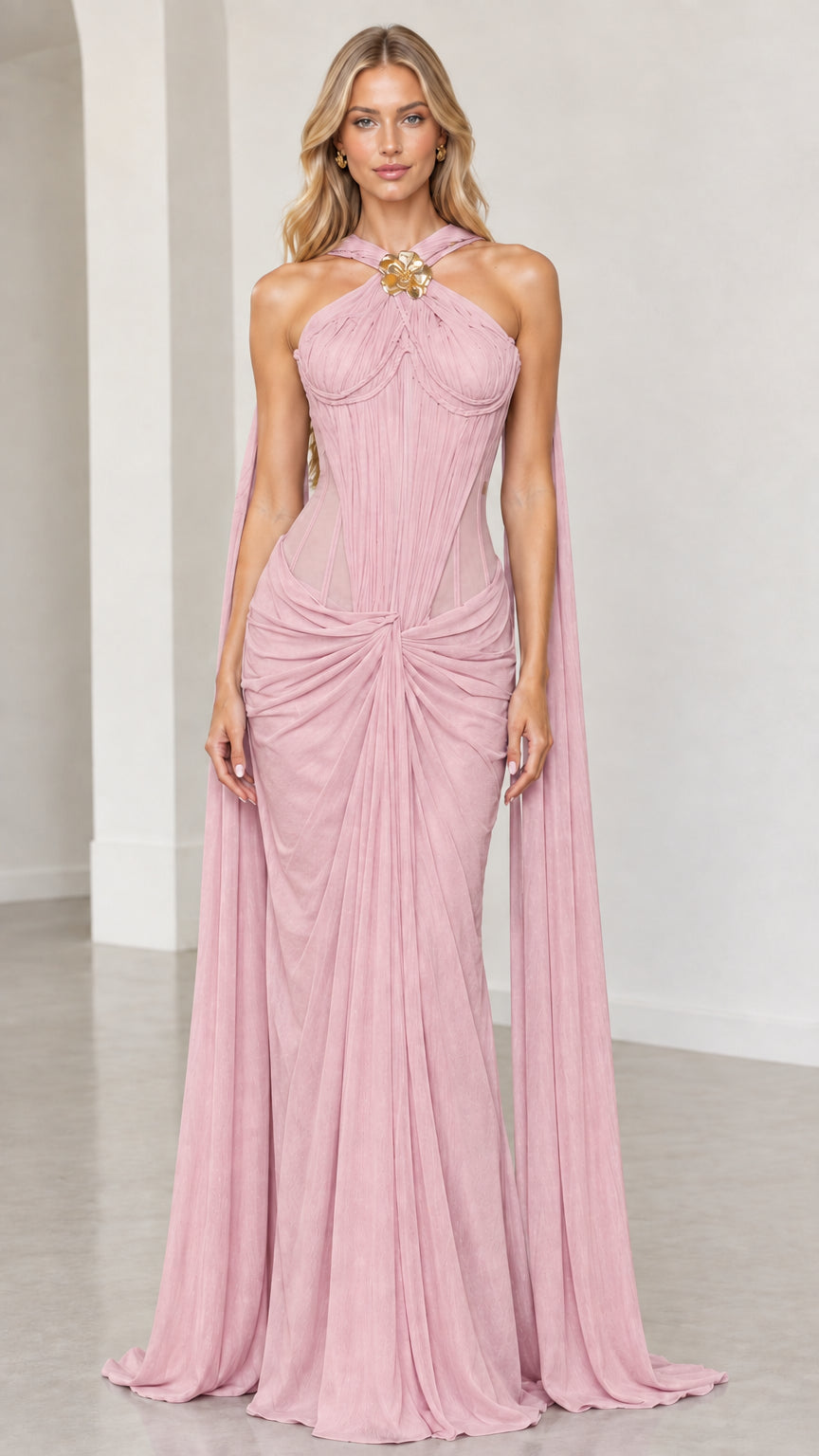 Front view of blush pink halter corset draped formal maxi gown