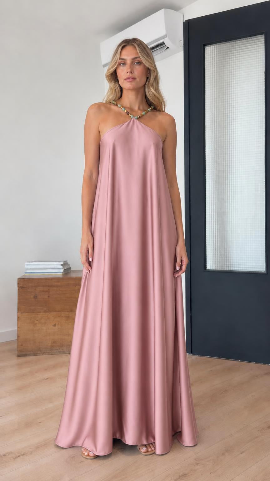 Model wearing pink satin halter maxi dress