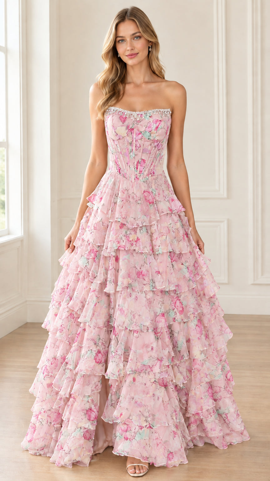 Front view of model wearing soft pink floral strapless tiered ruffle maxi dress