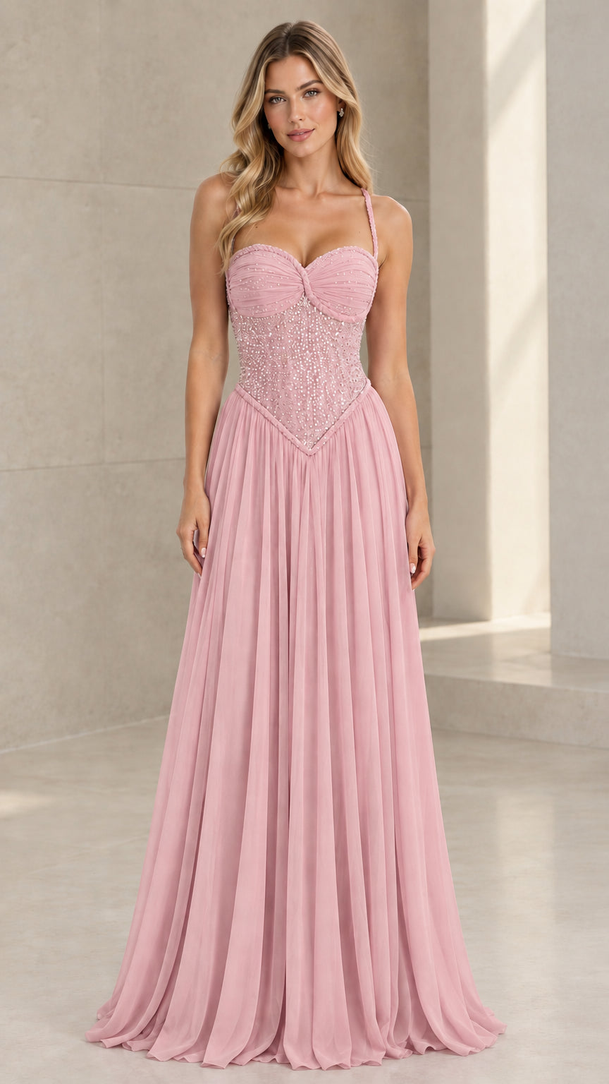 Front view of model wearing Blush Pink sweetheart beaded chiffon maxi gown