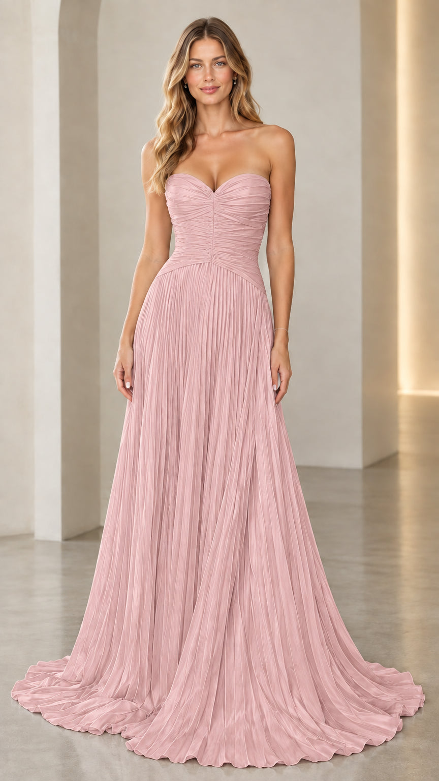 Model wearing dusty pink strapless sweetheart pleated evening dress