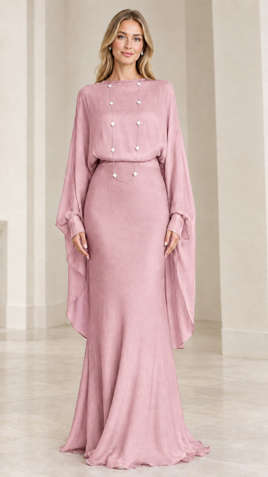 Front view of model wearing dusty pink draped cape-sleeve maxi evening dress