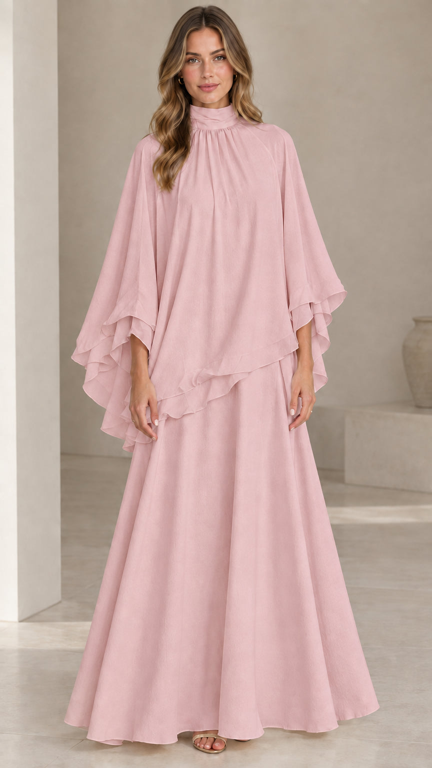 Front full-length view of model wearing dusty pink high neck capelet maxi dress set
