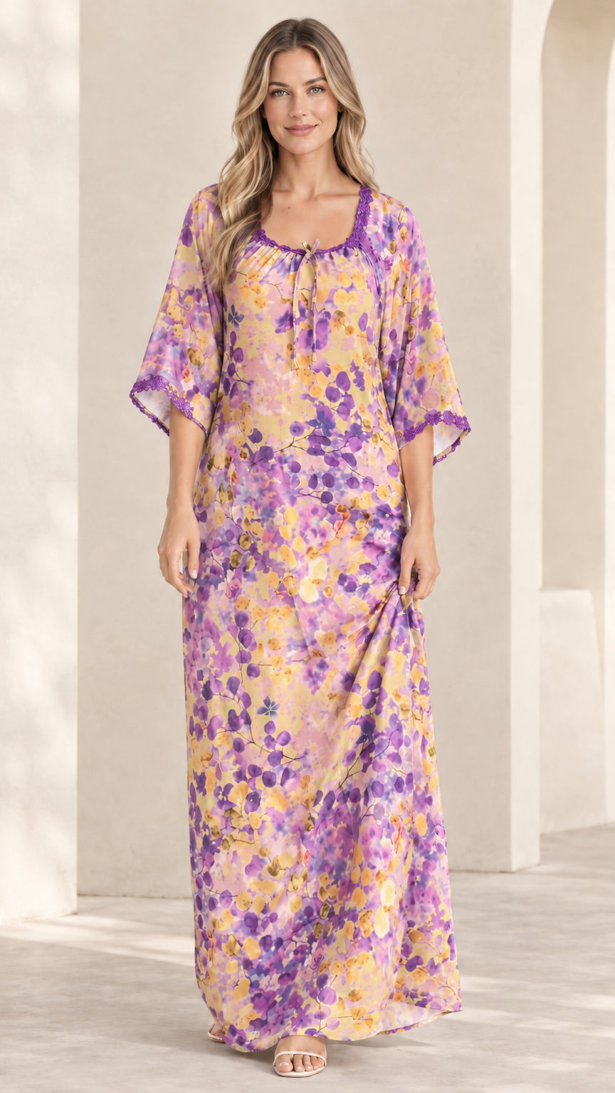 Front view of blush pink floral kaftan maxi dress with purple lace detailing