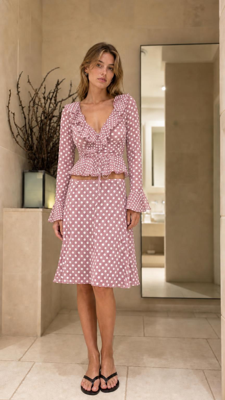 Front view of model wearing Pink polka dot matching set