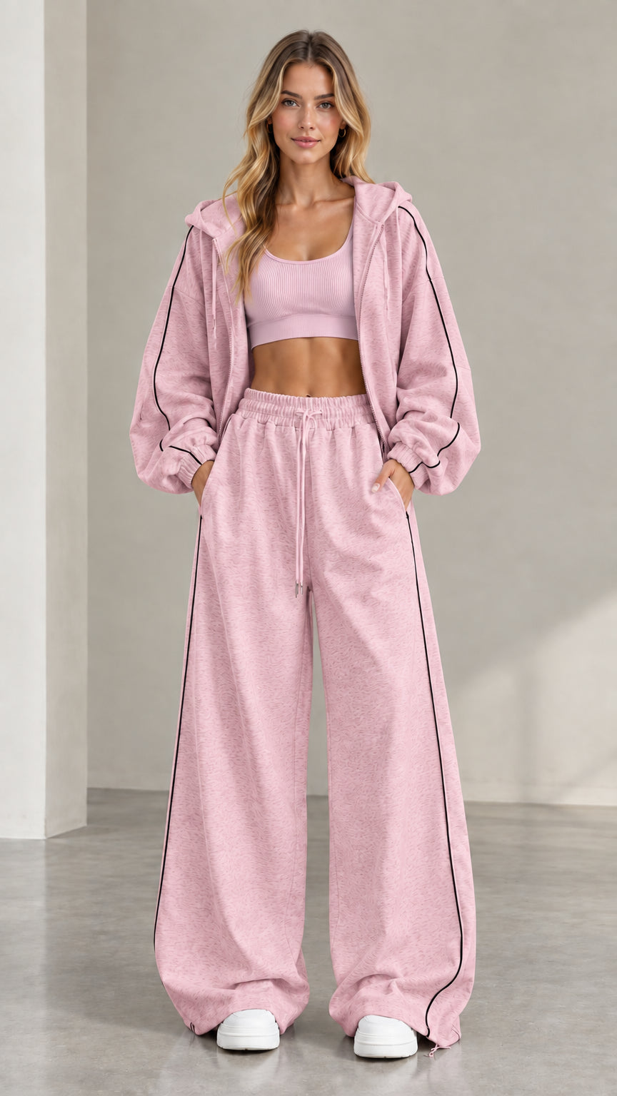 Model wearing Dusty Pink two-piece zip hoodie and wide-leg pants set