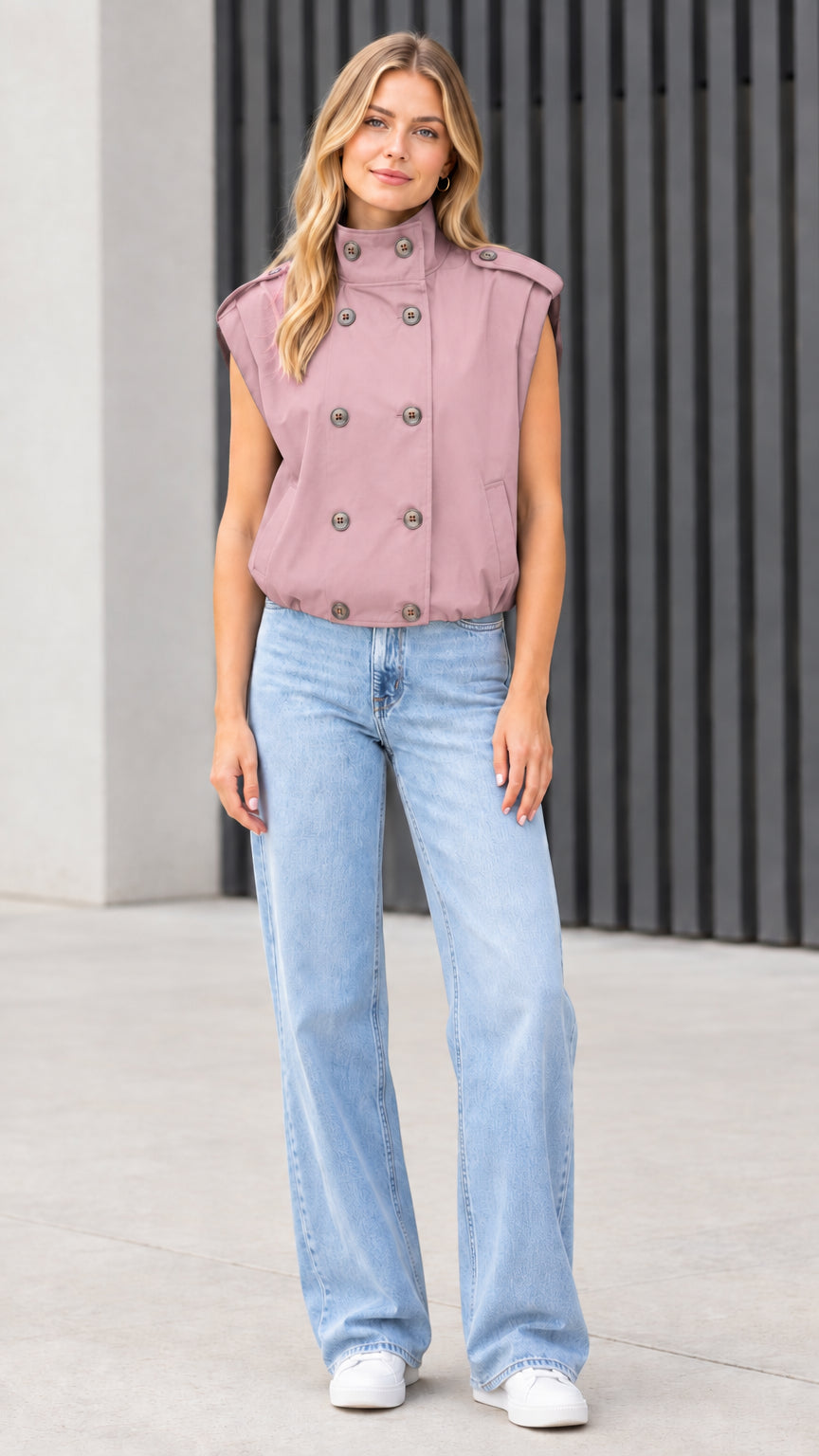 Front view of model wearing dusty rose pink double-breasted utility vest