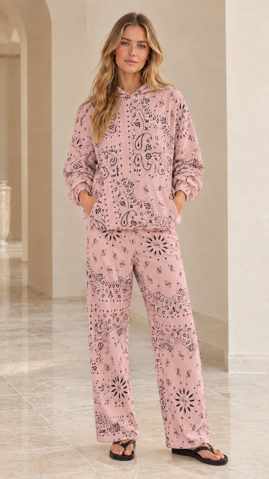 Full-body view of woman wearing dusty pink bandana print two-piece loungewear set