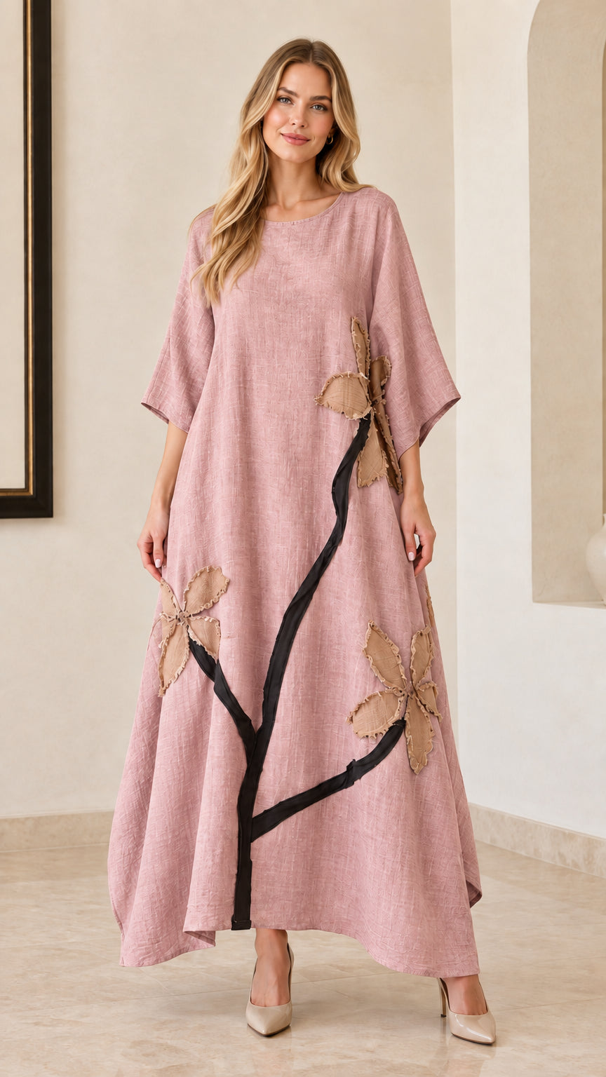Woman wearing dusty pink floral appliqué linen-look maxi dress