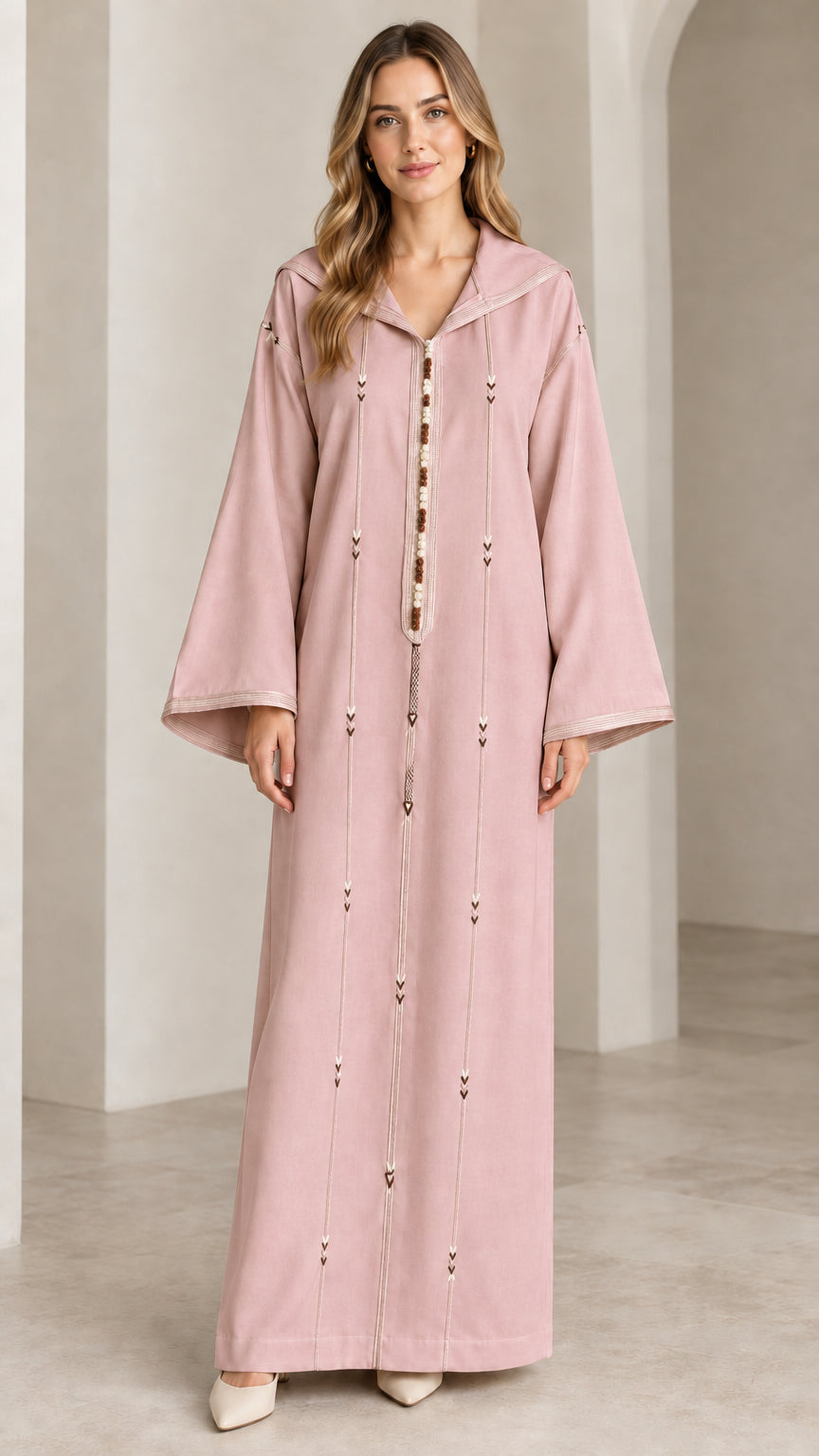 Front view of woman wearing dusty pink hooded djellaba kaftan maxi dress