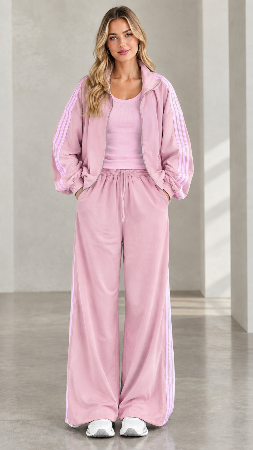 Front view of model wearing dusty pink tracksuit set with side stripes