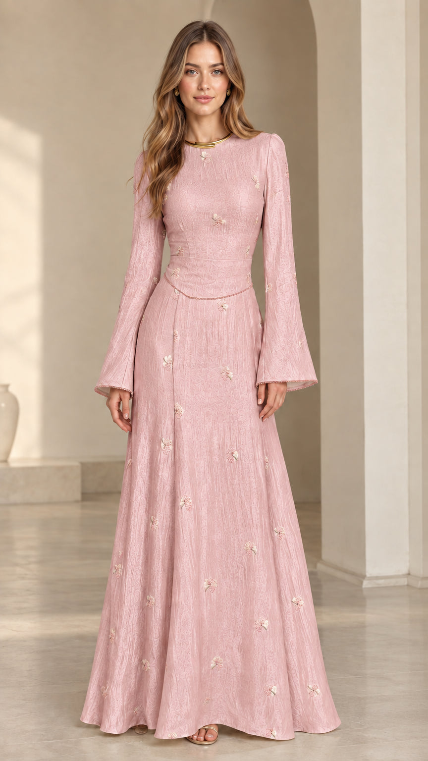 Front view of model wearing blush pink floral jacquard bell sleeve maxi dress