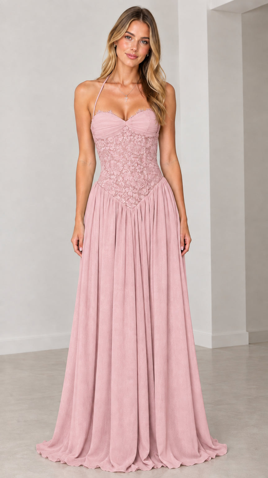 Front view of model wearing dusty pink lace halter maxi gown