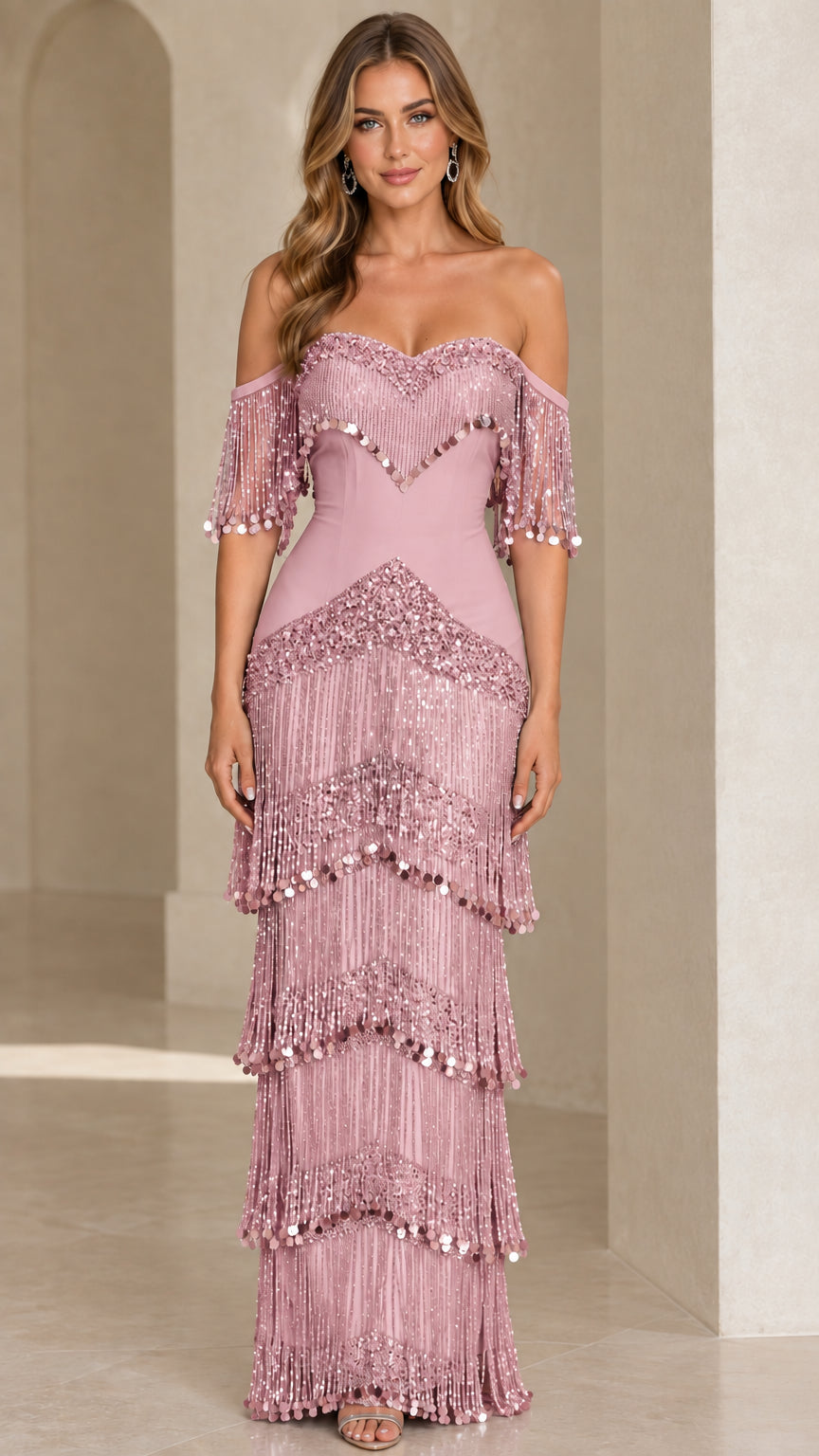 Full-length view of dusty pink tiered fringe off-the-shoulder formal gown