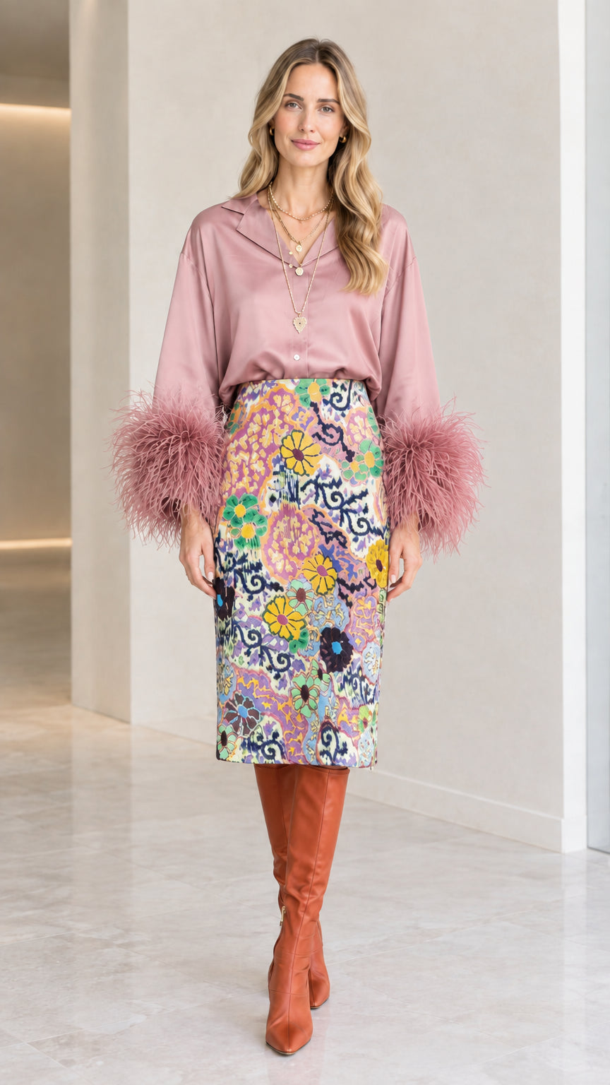 Dusty pink satin blouse with soft pink feather cuffs and floral pencil skirt