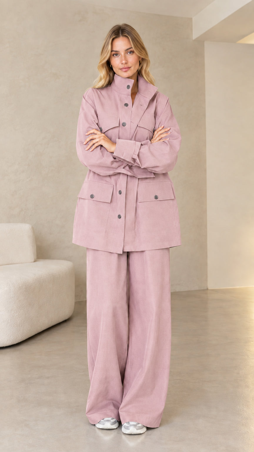 Model wearing soft dusty pink matching utility jacket and pants set