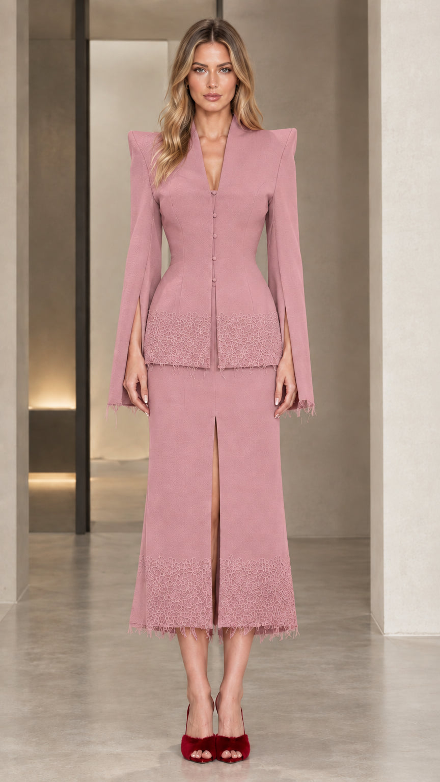 Front view of model wearing the dusty pink sculpted blazer and midi skirt set