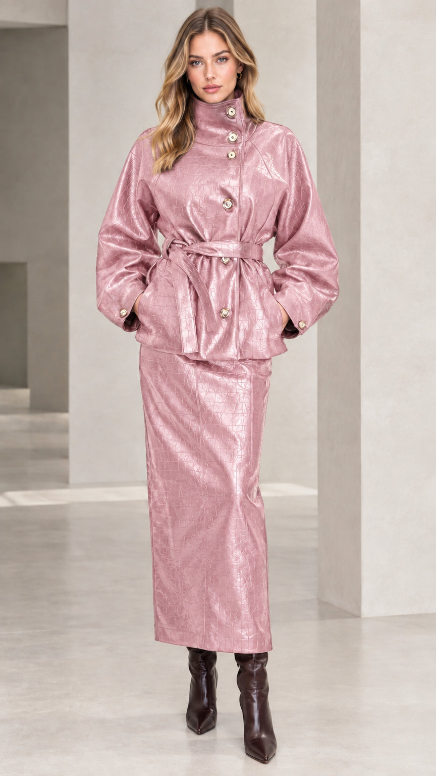 Woman wearing Dusty Pink croc-embossed faux leather belted jacket and matching maxi skirt set