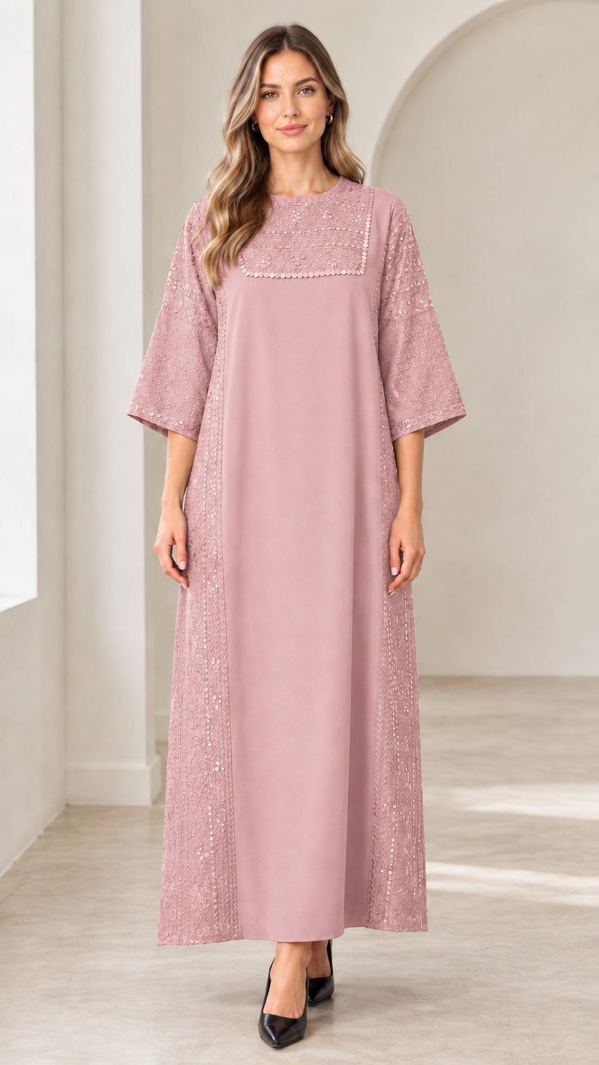 Front view of woman wearing dusty pink sequin embellished maxi dress