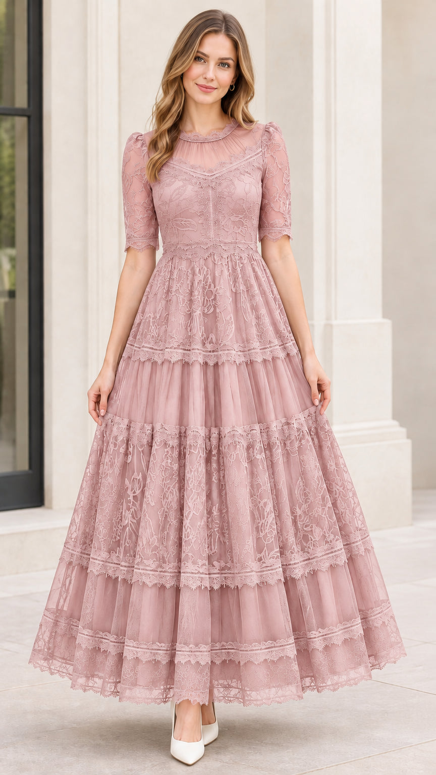 Model wearing dusty pink illusion lace tiered A-line formal gown