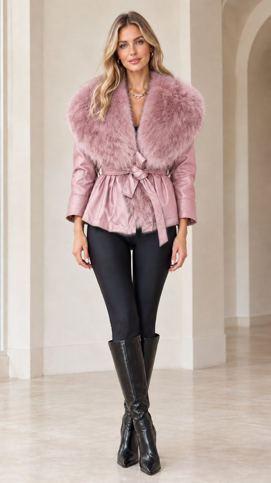 Front view of model wearing dusty pink faux leather jacket with matching pink faux fur collar
