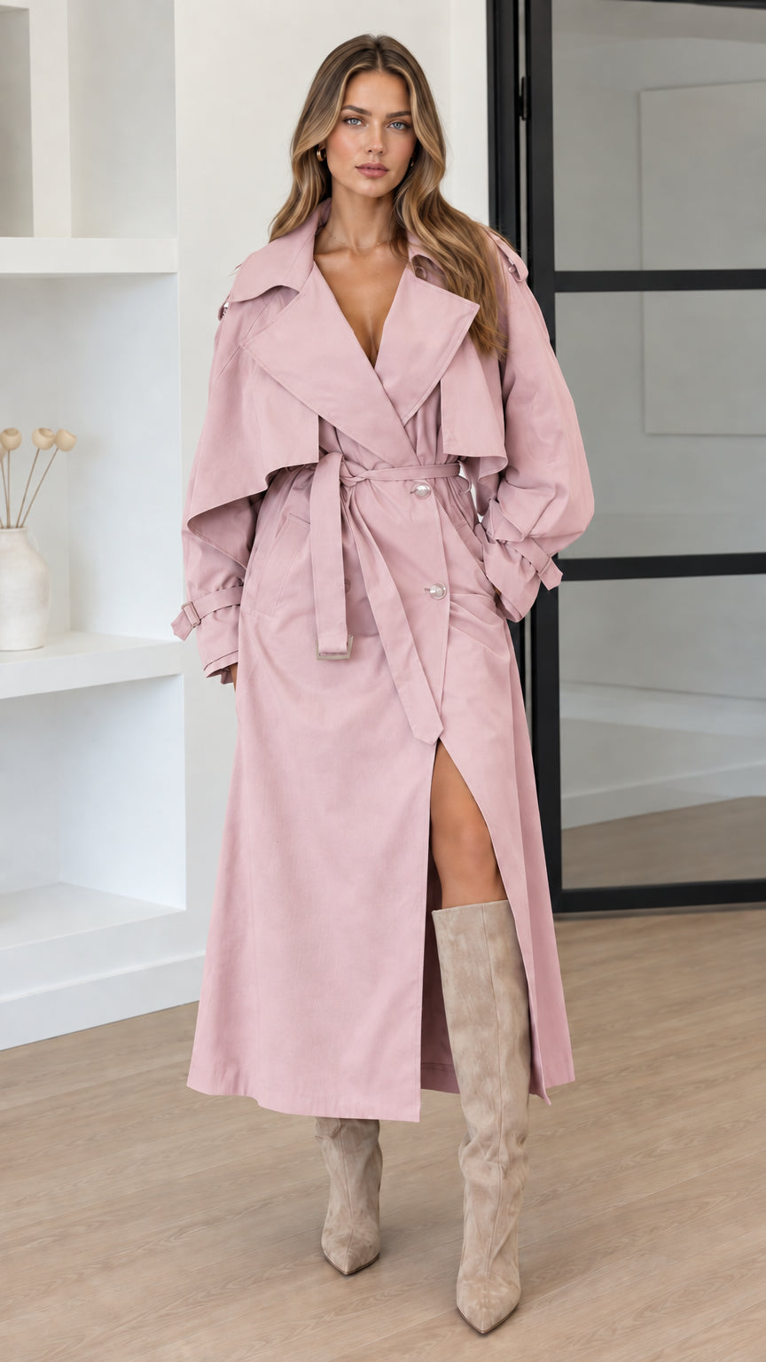 Front view of woman wearing Blush Pink oversized maxi trench coat with belt