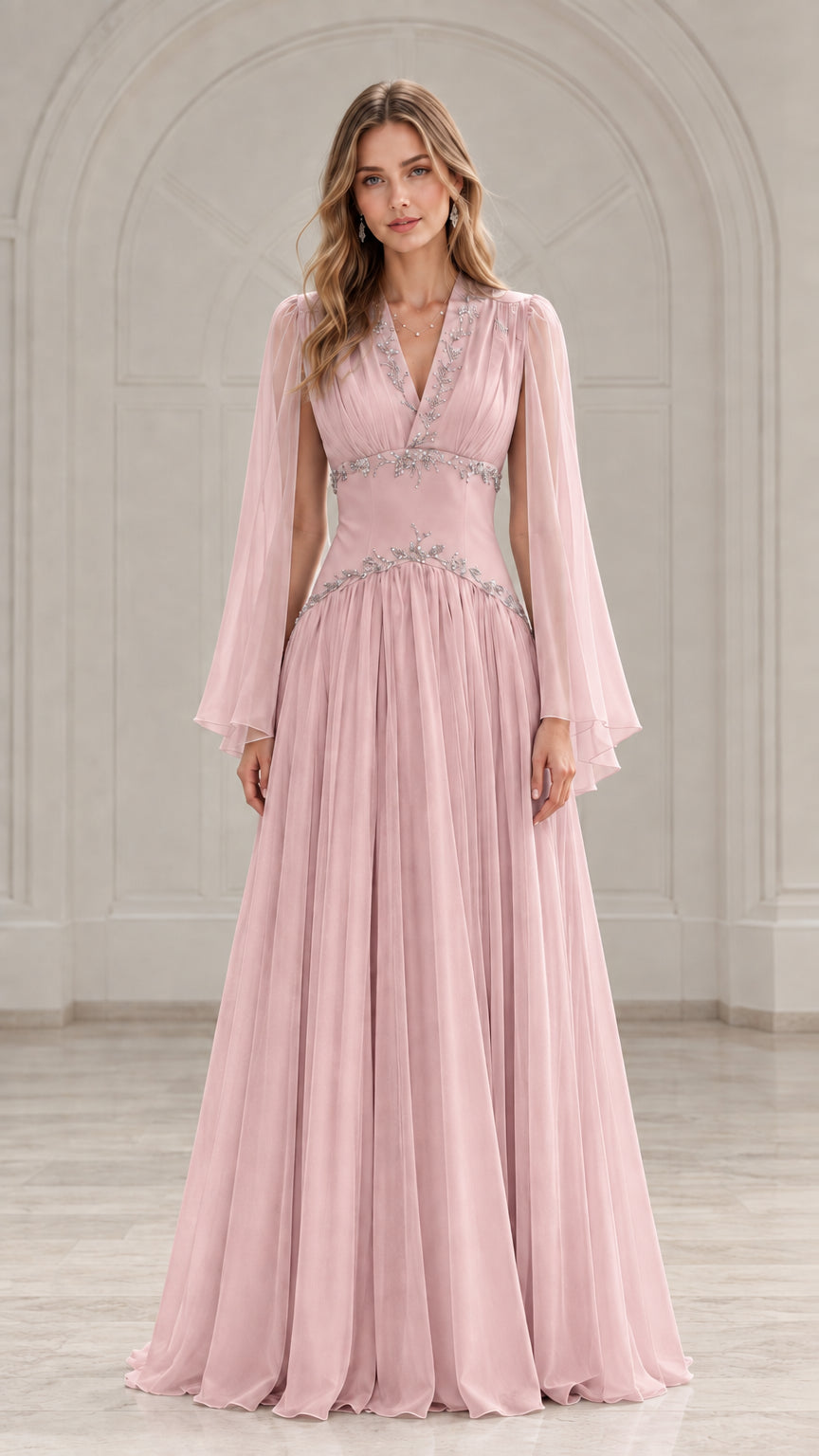 Front view of model wearing a blush pink pleated chiffon evening dress with beading