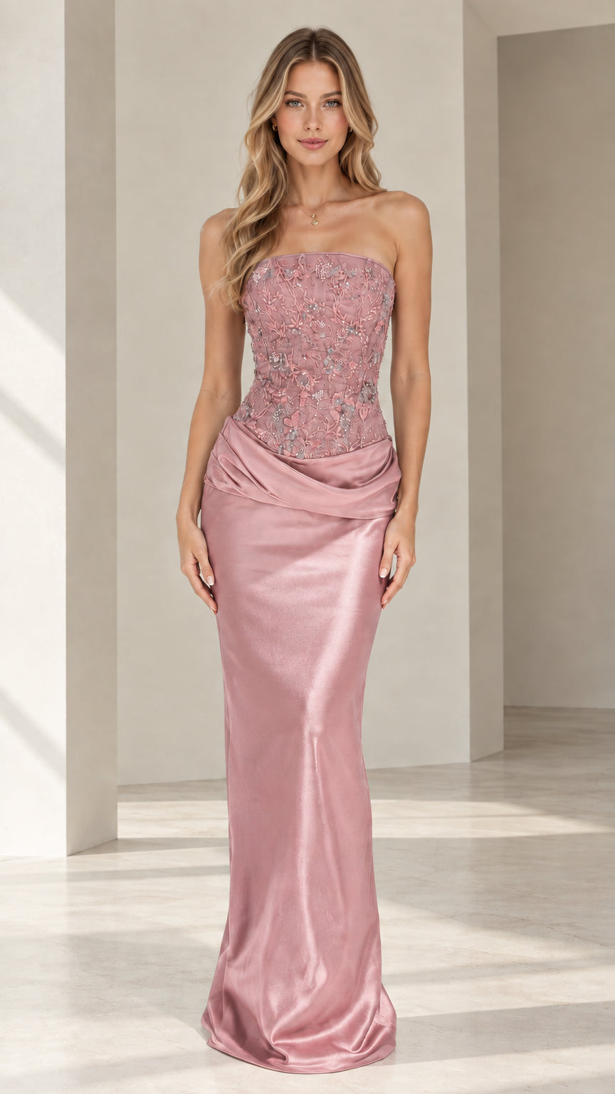 Model wearing dusty rose strapless beaded corset satin evening gown