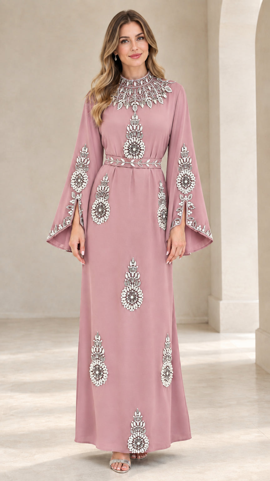 Front view of woman wearing dusty pink rhinestone embellished maxi dress