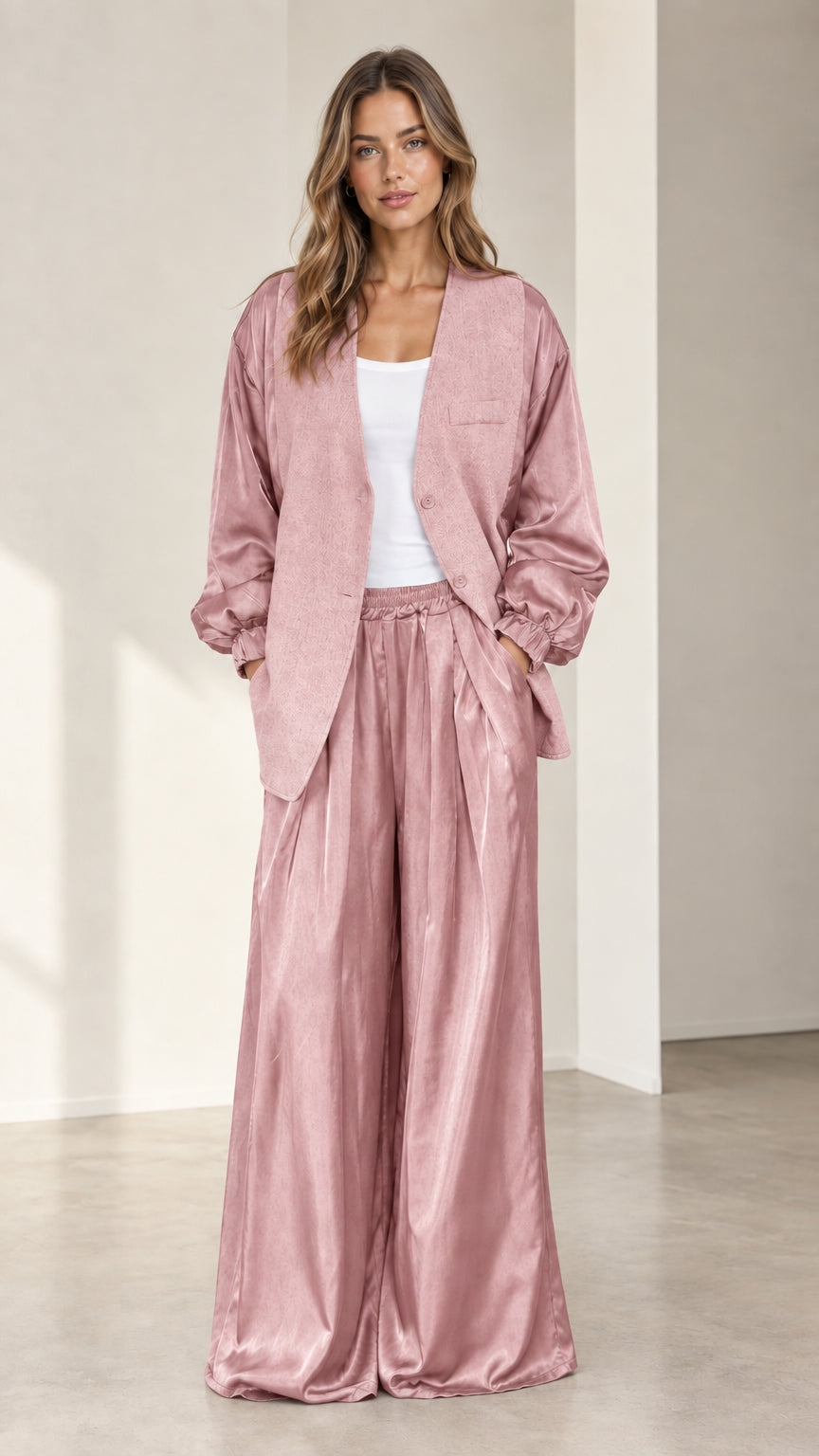 Front view of model wearing dusty pink satin sleeve blazer and matching wide-leg trousers