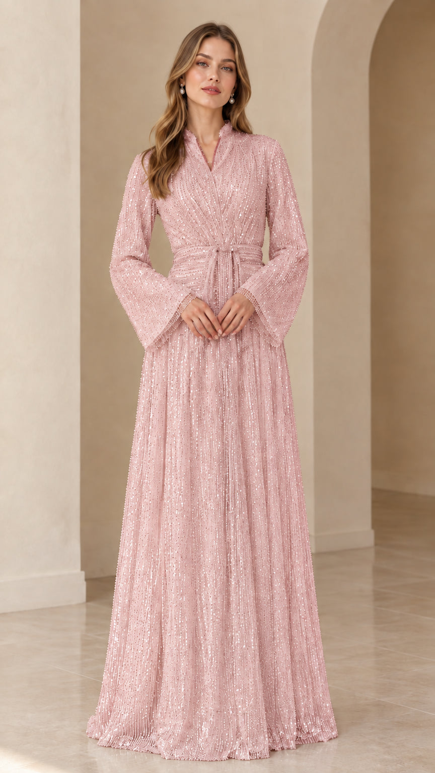 Front view of model wearing blush pink sequined long sleeve maxi dress