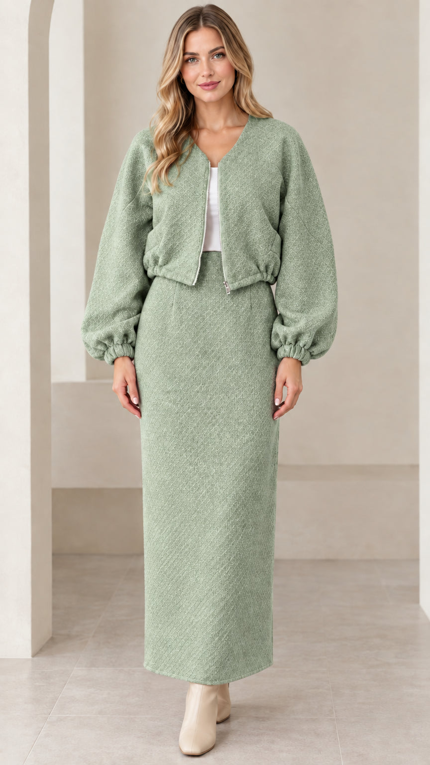 Full-length front view of sage green textured cropped jacket and maxi skirt set