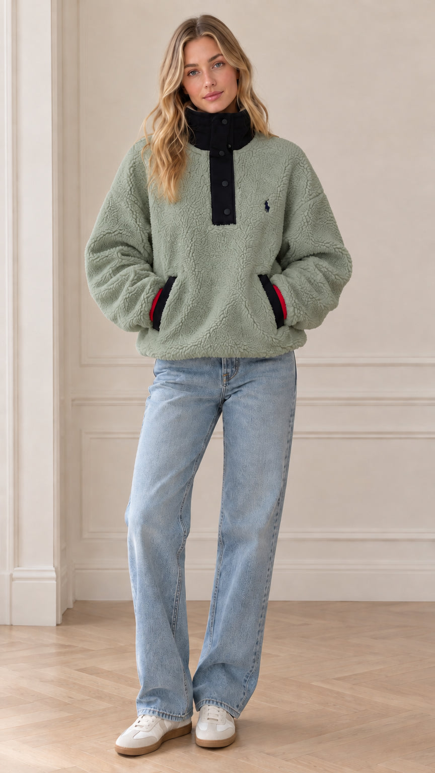 Front view of model wearing sage green sherpa fleece snap-neck pullover