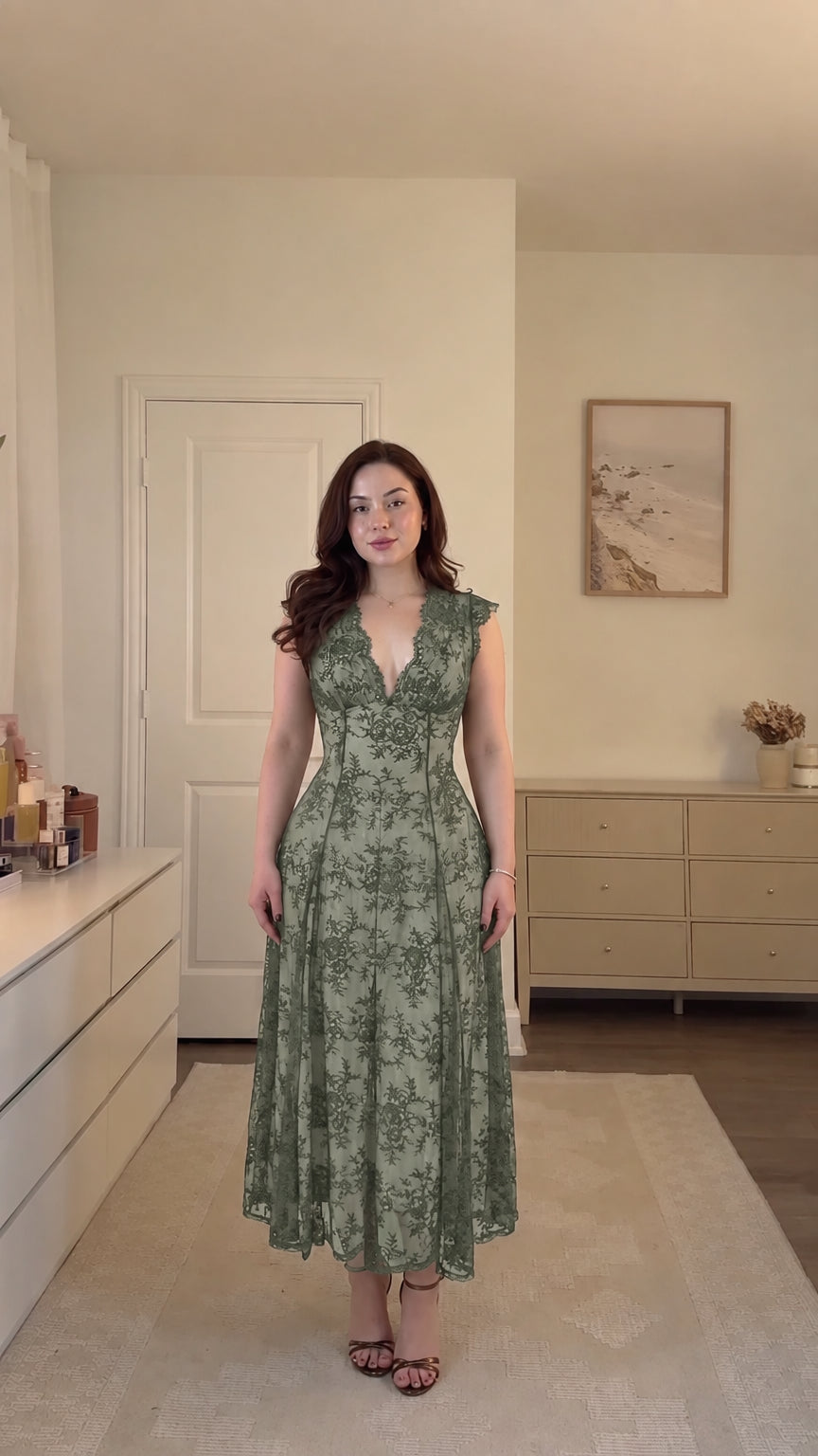 Model wearing sage green floral lace corset midi dress