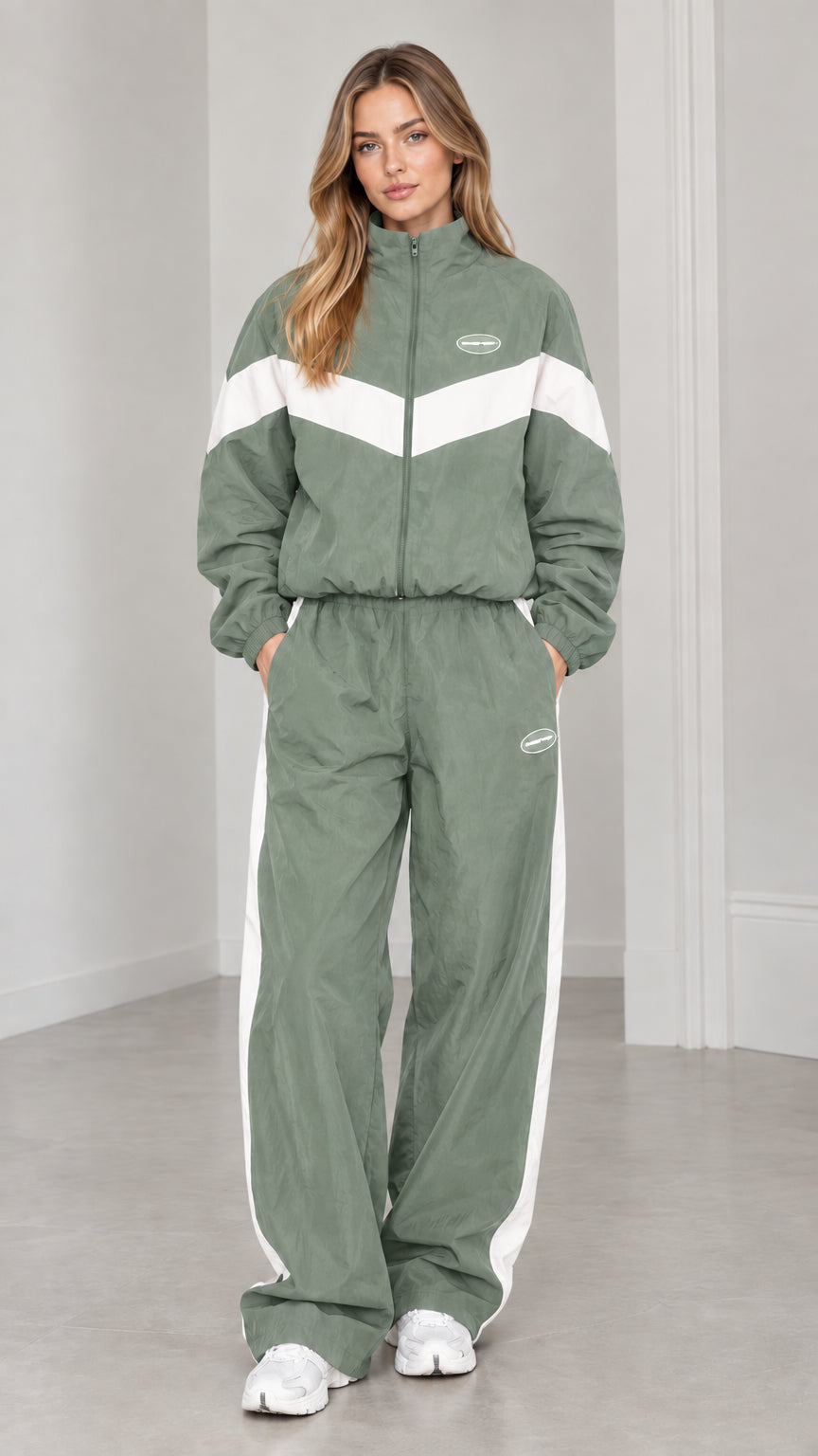 Full length view of woman wearing sage green and white colorblock tracksuit set