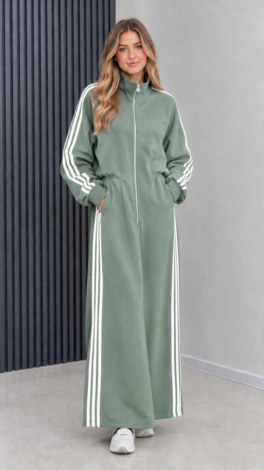 Front view of model wearing sage green sporty long sleeve maxi track dress