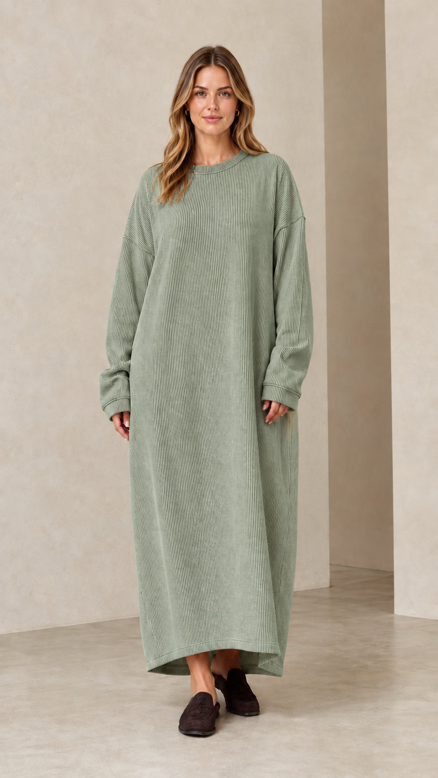 Woman wearing sage green ribbed knit long sleeve maxi dress