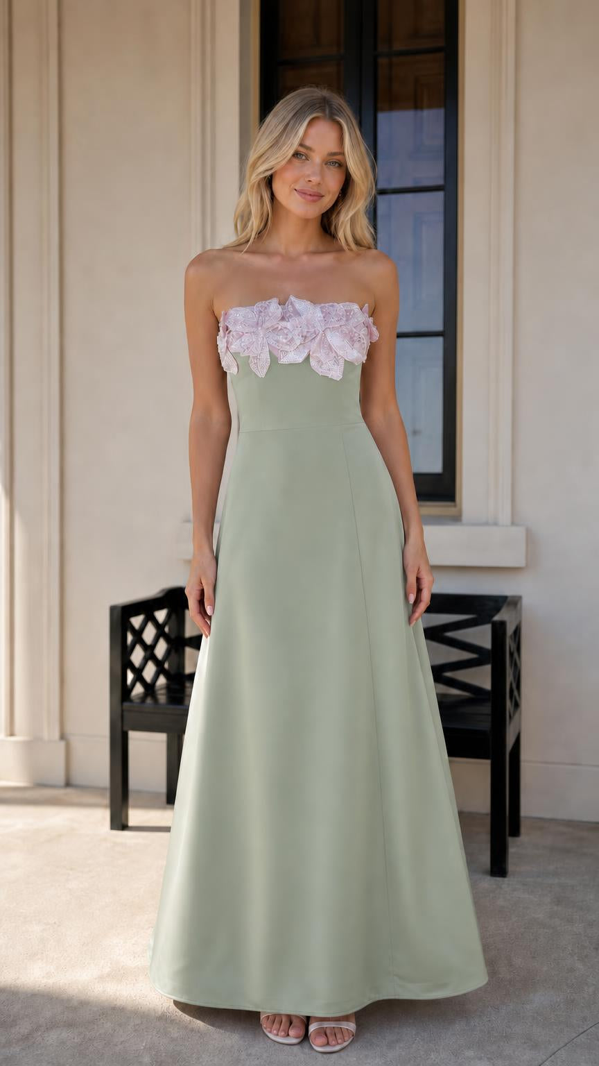 Model wearing sage green evening dress with floral bodice