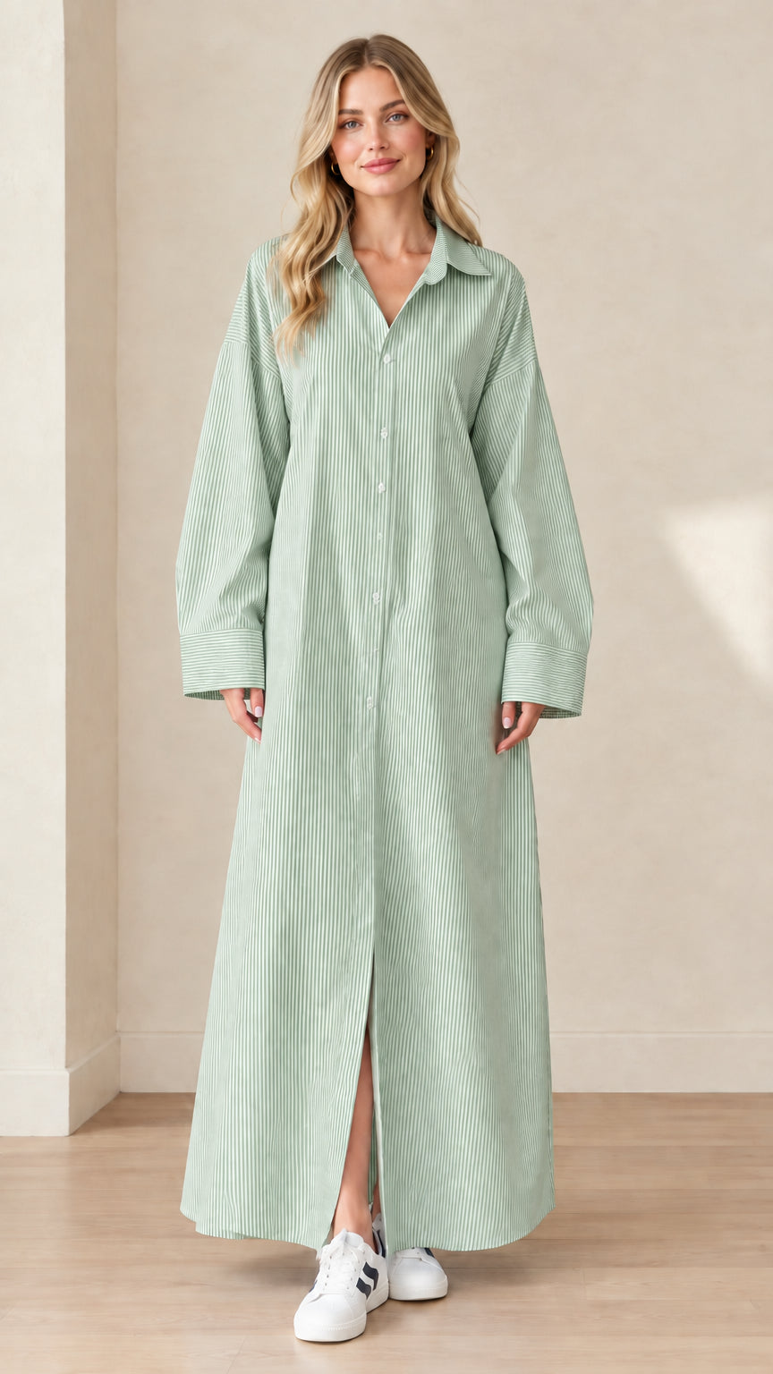 Front view of a model wearing a sage green and white striped maxi shirt dress